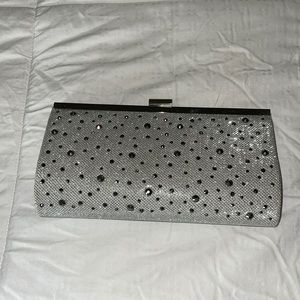 Silver clutch with strap used once